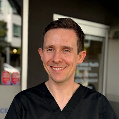 Massage Therapist Malachy O'Connor Smiling Outside The Clinic