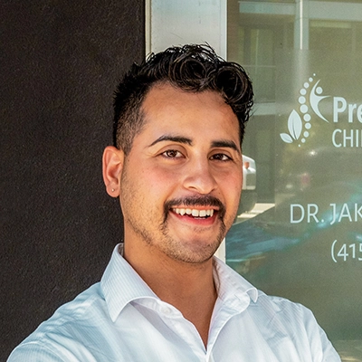 Chiropractor Jake Castrejon Smiling Outside The Clinic