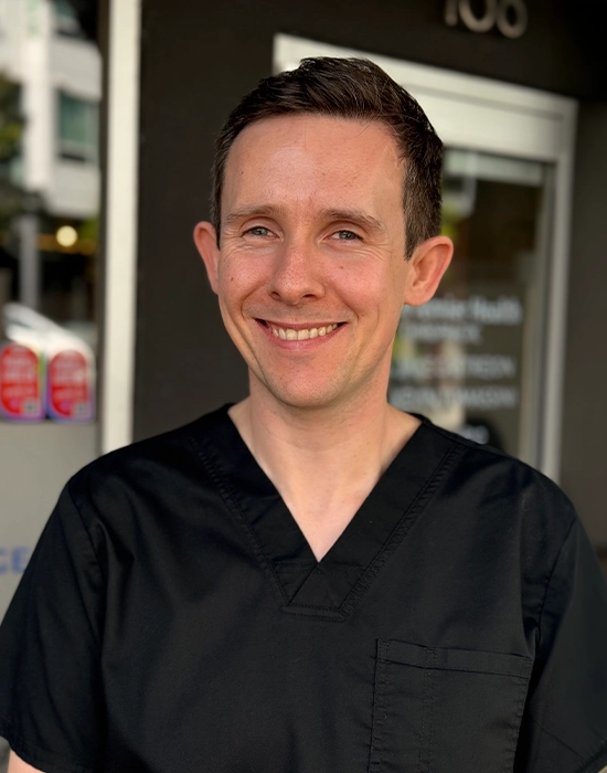 Massage Therapist Malachy O'Connor Smiling Outside The Clinic